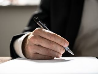 Signing an important document